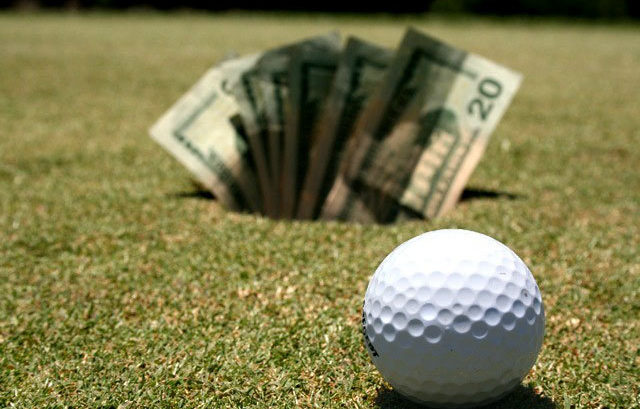 golf ball and money