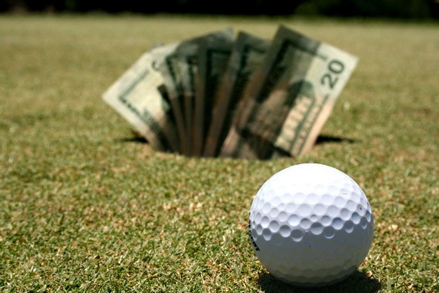 golf ball and money